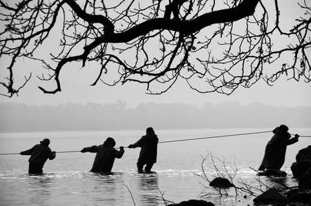 Fishermen in the waterの写真素材