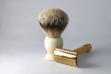 Gold old fashioned double edge razor with shaving badger brushの写真素材