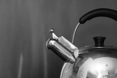 Boiling hot water in a whistling kettleの写真素材
