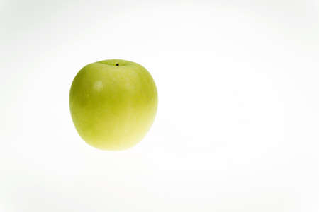 Green apple on a white の写真素材
