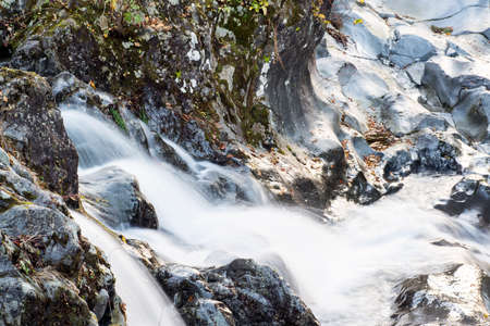 A fast flowing river at the Kanmangafuchi Abyss at Nikko Japanの写真素材