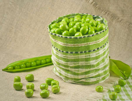 Green peas in a bag on a linen napkin.の写真素材