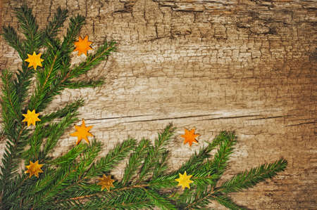 Christmas fir tree on old wooden board ,Ñhristmas green framework の写真素材