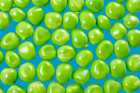 Green peas isolated on blue  Background from peas 