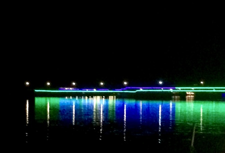 Reflections on water at nightの写真素材