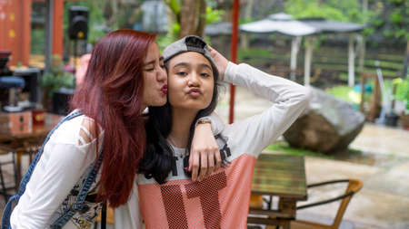 Two sister showing love to each otherの写真素材