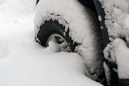 Car Covered With Snow After a Winter Blizzardの写真素材