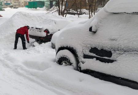 Car Covered With Snow After a Winter Blizzardの写真素材