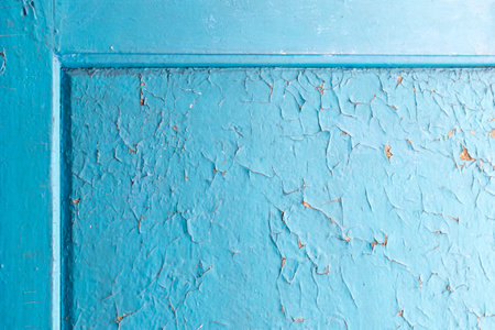 Grunge Background with Old Wooden Painted Blue Wall. Bubbles and Cracks Shabby Texture