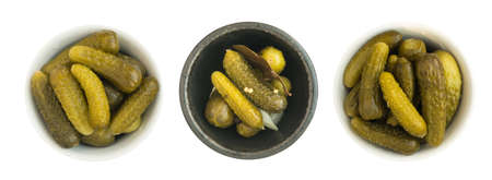 Homemade Pickled Gherkins or Cucumbers in Round Bowls. Fermented Food with Spices Isolatedの写真素材