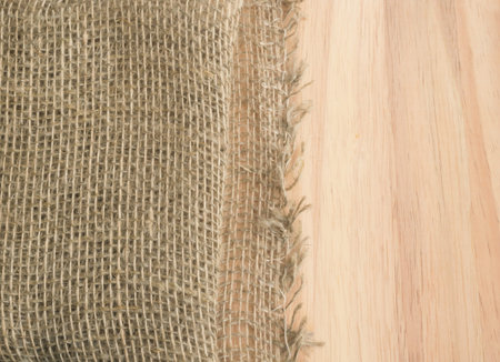 Burlap Edge and Wooden Background. Old Linen Canvas Textureの写真素材