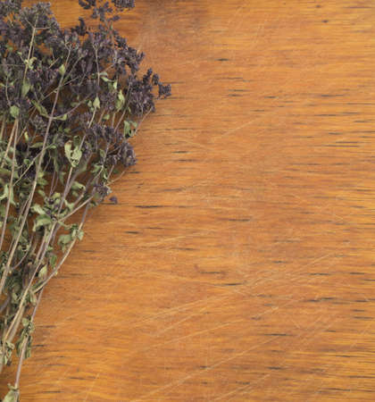 Dried Aromatic Herbs on a Wooden Background. Marjoram or Oregano with Natural Light Top Viewの写真素材
