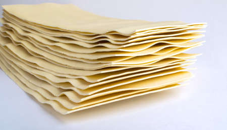 Heap of Uncooked Lasagna Sheets or Dry Italian Pastaの写真素材
