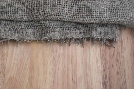 Burlap Edge and Wooden Background. Old Linen Canvas Textureの写真素材