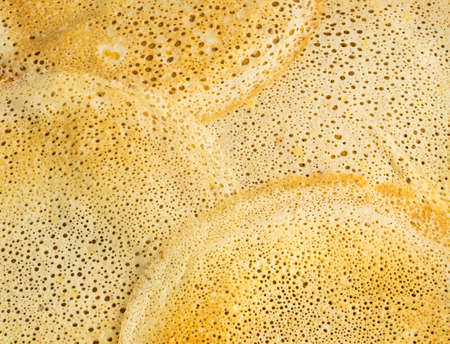 Thin Pancakes on a Wooden Background Top View. Fresh Homemade Crepes Flat Layの写真素材