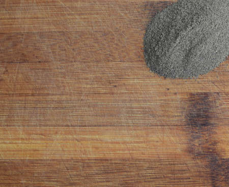 Heap of Ground Black Pepper on Old Wooden Background Top Viewの写真素材