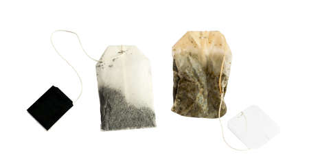 New and Used Tea Bag with Black Labels Isolated on White Backgroundの写真素材