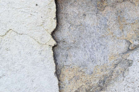 Grunge Background with Dirty Lime Plaster and Dark Cracks. Aged Wall Textureの写真素材
