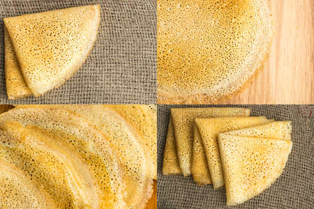 Thin Pancakes on a Wooden Background Top View. Fresh Homemade Crepes Flat Layの写真素材