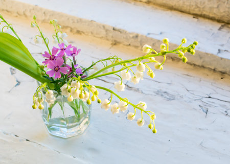 Bouquet of Lilies of the Valley on the Old Rustic Window with Evening Lighting