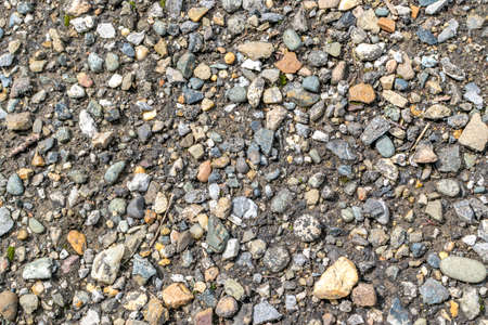 Gray and Brown Wet Gravel Road. Various Gravel Background or Texture. Small stones photography patternの写真素材