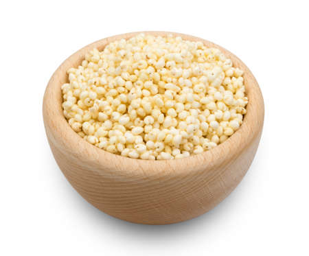 Puffed Millet Snack in Wooden Round Bowl Isolated. Healthy Cereal Vegetarian or Vegan Food with Clipping Pathの写真素材