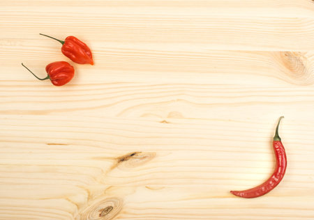 Orange Chili Pepper Habanero on New Wooden Background
