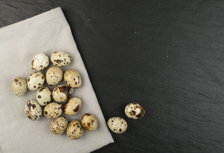 Quail Eggs on Stone Background Closely. Small Whole Eggs Top View with Place for Text