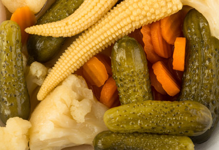 Mixed Pickles Pattern Top View. Marinated Cucumber, Carrot, Perl Onion, Baby Corn, Paprika or Red Pepper, Cauliflower, Olives and Capersの写真素材