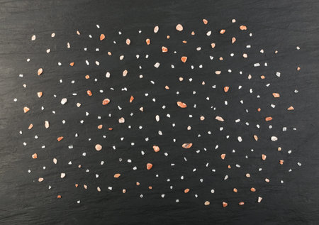 Himalayan Pink Salt Pattern. Sea Salt Crystals on Natural Stone Background Top Viewの写真素材