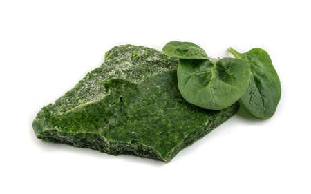 Frozen Spinach Isolated on White Background. Frosty Icy Green Vegetableの写真素材