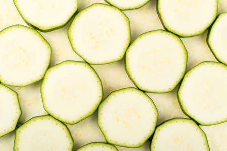Sliced Zucchini Background. Chopped Squash Texture Top View and Flat Layの写真素材