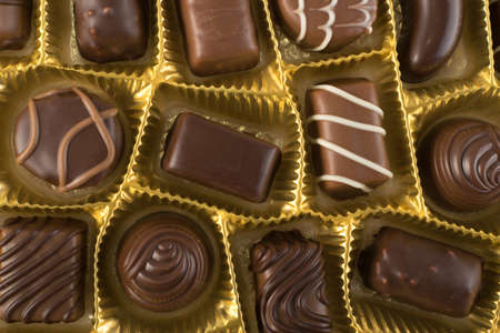 Assortment of Beautiful Sweet Chocolates in Box Top View. Chocolate Pralines Mix Backgroundの写真素材