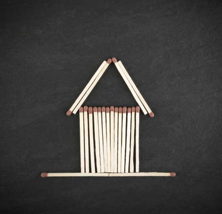 Match Sticks House or Safety Matches One on Black Stone Background. Macro Photography of Matchsticks Top Viewの写真素材