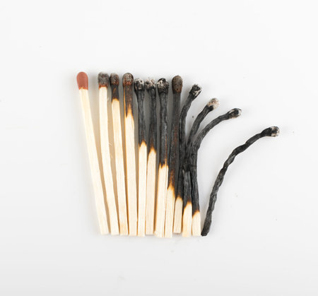 Different Stages of Match Sticks Burning or Safety Matches on White Paper. Macro Photography of...