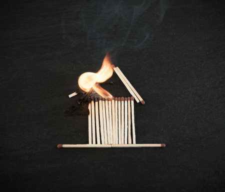 Burning Matches House for Fire Insurance Illustration. Flammable Homeの写真素材