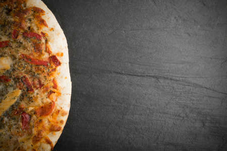 Whole Round Chicken Pizza on Natural Stone Background Top View. Italian Food with Place for Textの写真素材