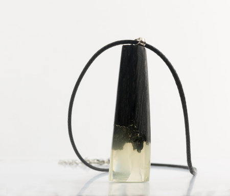 Pendant with Translucent Crystal Isolated on White Background. Bijouterie Made of Epoxy Resin and...