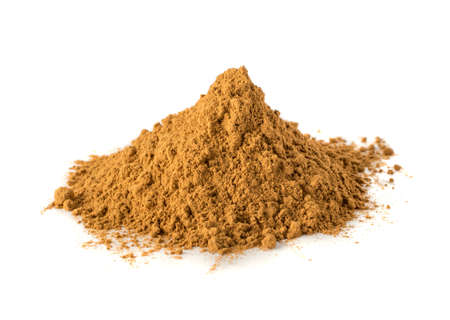 Macro Foto of Cinnamon Powder Isolated on White Background. Ground Cinamon Bark Closeupの写真素材