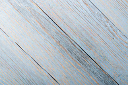 Beautiful vintage pale blue wood background. Light old painted wooden table surface. Rustic light...
