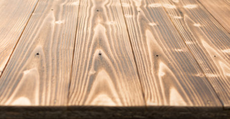 Old dark burnt wood background. Scorched wooden board plank texture. Natural rustic photo backdrop for vintage hipster designの写真素材