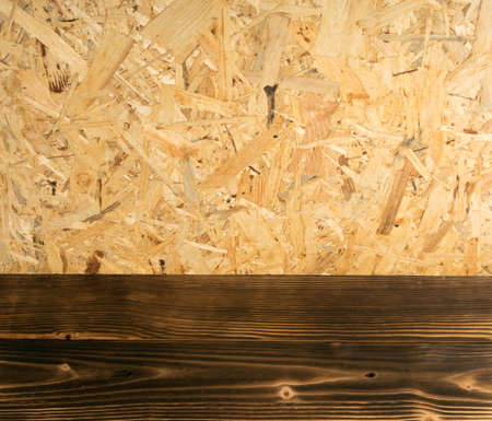 Chipboard background top view. Light brown osb panel texture or pressed and glued wood chips backdropの写真素材