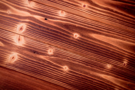 Old dark cherry wood background. Red wooden board plank texture. Beautiful natural rustic photo...