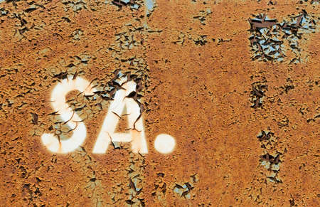 Letters S, A on Dark Rusted Metal Texture Background. Old Erased Inscription SA Logotype, Symbol, Monogram on Peeling Paintの写真素材
