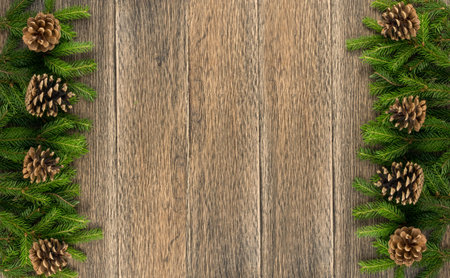 Christmas background with fir branches on wooden backdrop flat lay and top view. Yuletide floral...