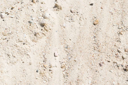 Heap of Sand, Gravel, Pebbles and Concrete Mix for Construction Closeup in Sunny Day. Contrast Photo of Desert Sandy Ground with Small Stones Texture, Background or Patternの写真素材