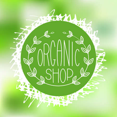 Hand Drawn Natural Eco Bio Product Label or Round Ecology Banner. Sketched Vector Illustrations on Abstract Green Blurred Background with Natural Organic Badge or Sale Tagのイラスト素材
