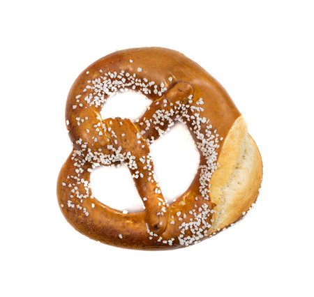 Pretzel with large salt crystals isolated on white background. Fresh fragrant brezel top view