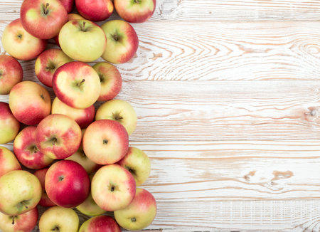 Whole Red and Green Soft Apple Pattern Ready for Juice Produce Top View. Organic Apples on Wooden...