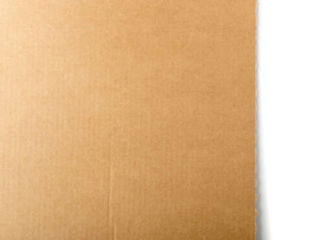 Brown cardboard paper background. Recycled paperboard texture or pattern top viewの写真素材